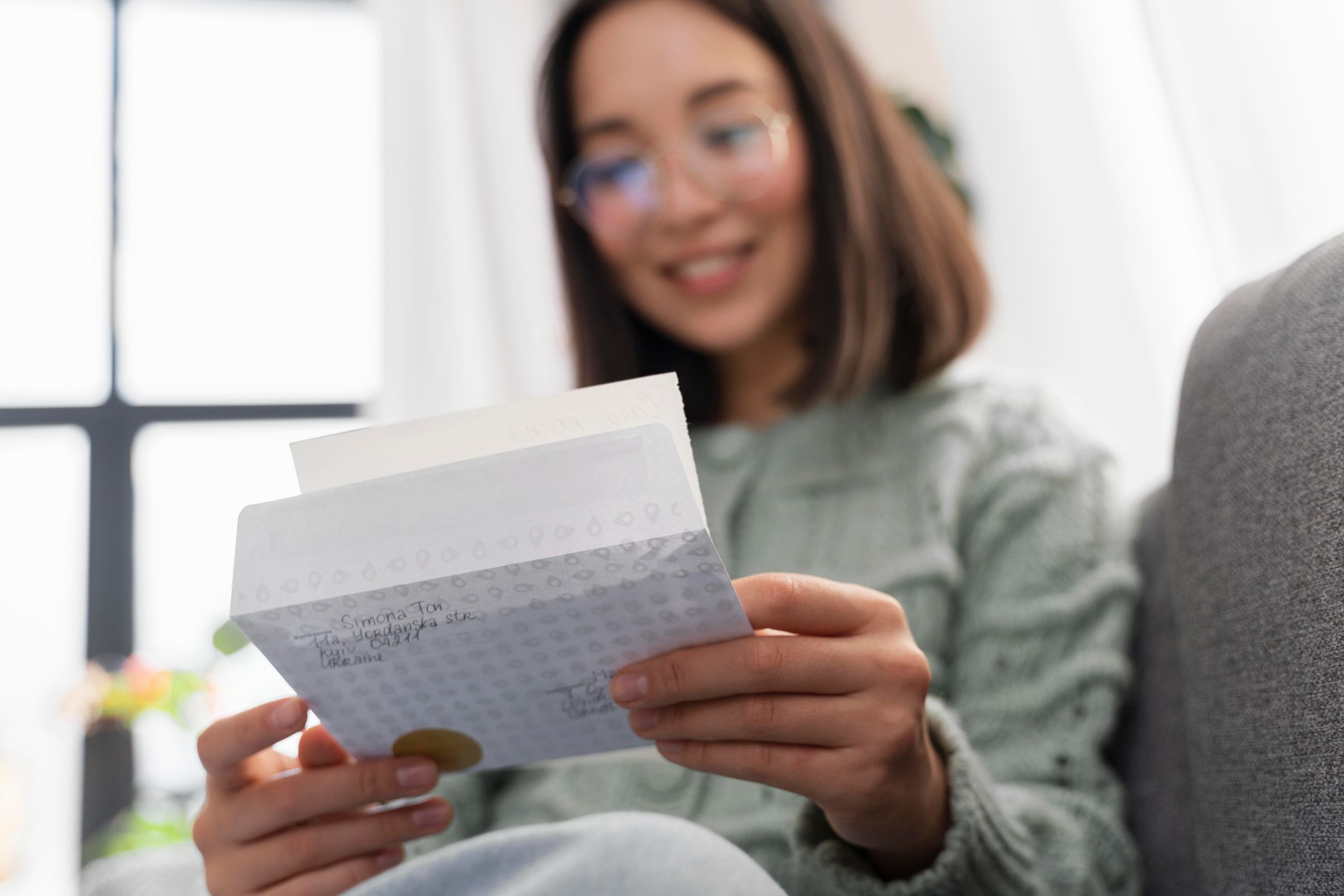 Woman reading the letter she got from an international company 